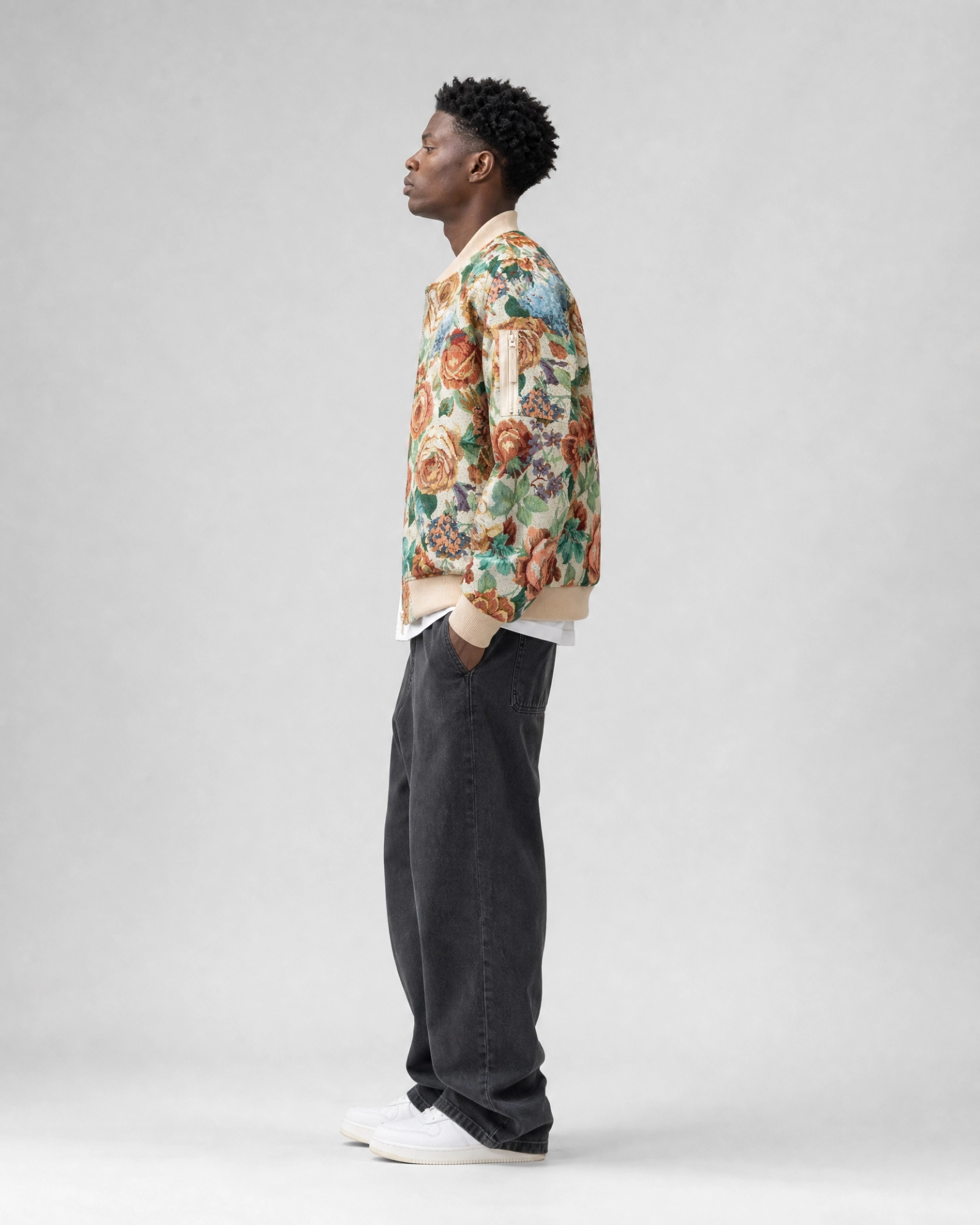 Ahikam tapestry bomber jacket side view with floral woven tapestry fabrication
