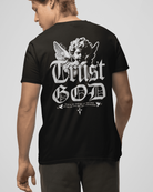 Person wearing a black t-shirt with 'Trust God' design on the back