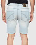 Model showing back view of Blue Bleached Men’s Ripper Denim Shorts by Ring of Fire