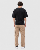 Model wearing Ledger khaki cargo pants with a relaxed fit tee back view