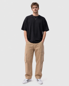 Model wearing Ledger khaki cargo pants with a relaxed fit tee front view
