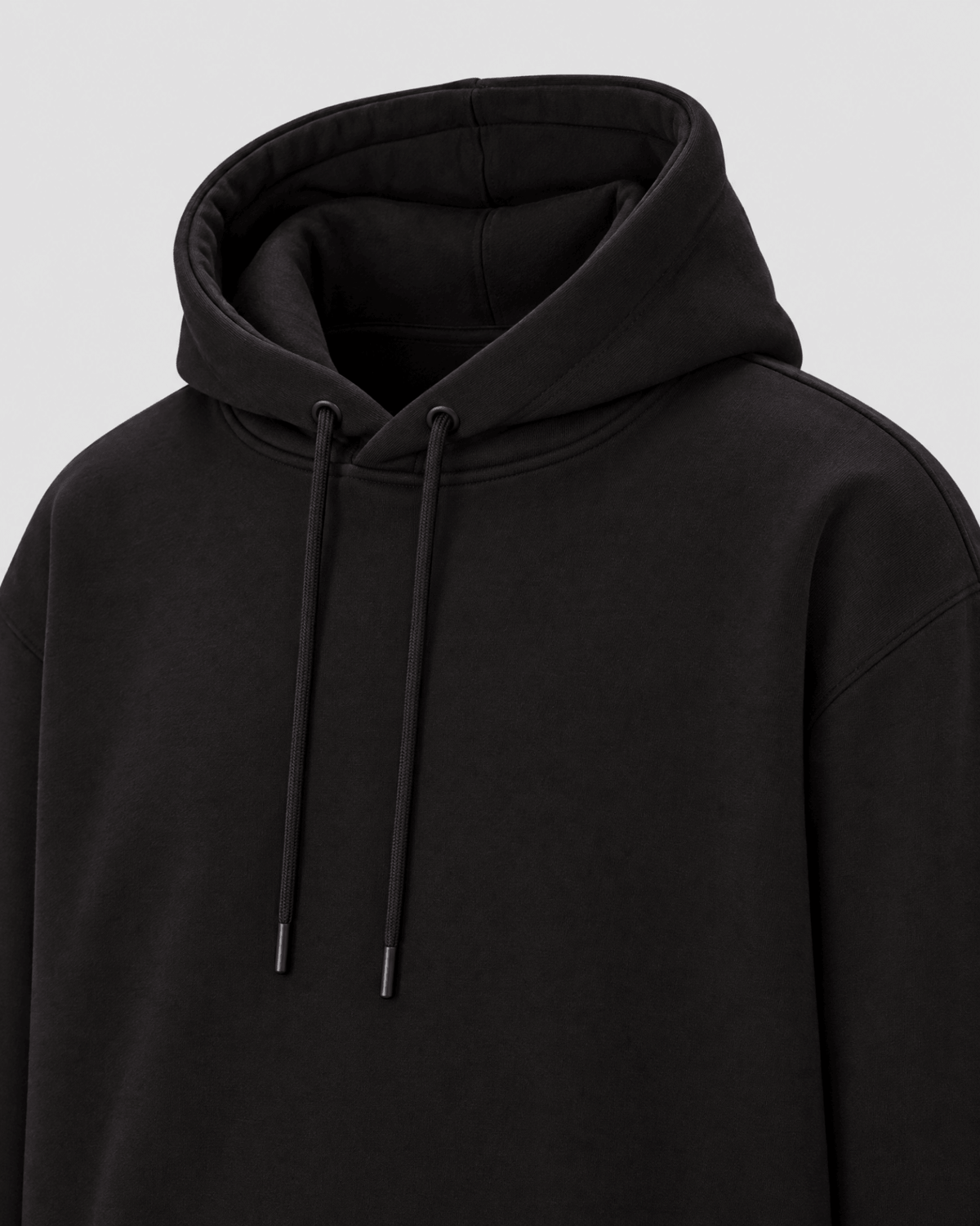 Black Heavyweight Pullover Hoodie hood construction detail with drawcords and premium fabric texture