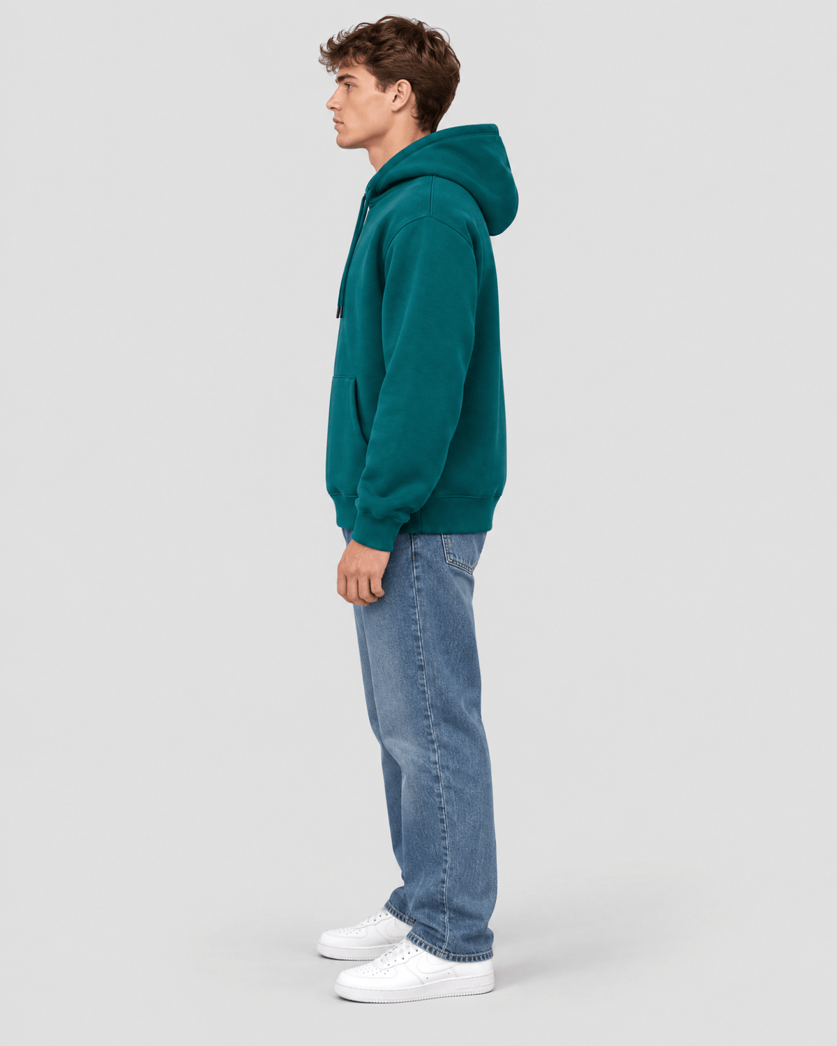 Men's Deep Teal Heavyweight Pullover Hoodie side profile view showing hood projection and overall fit