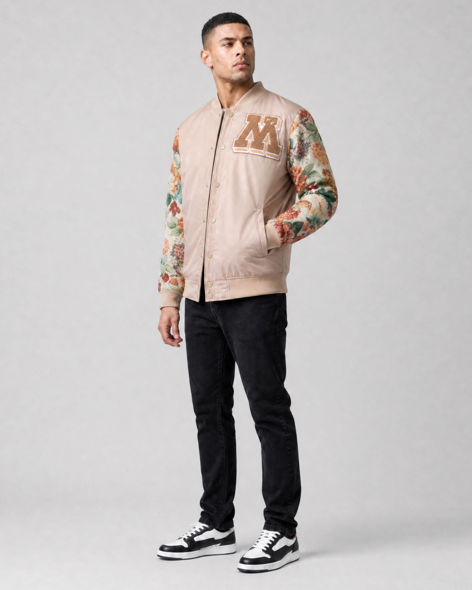Ring of Fire Gibeon tapestry varsity jacket tan colorway on model full body view
