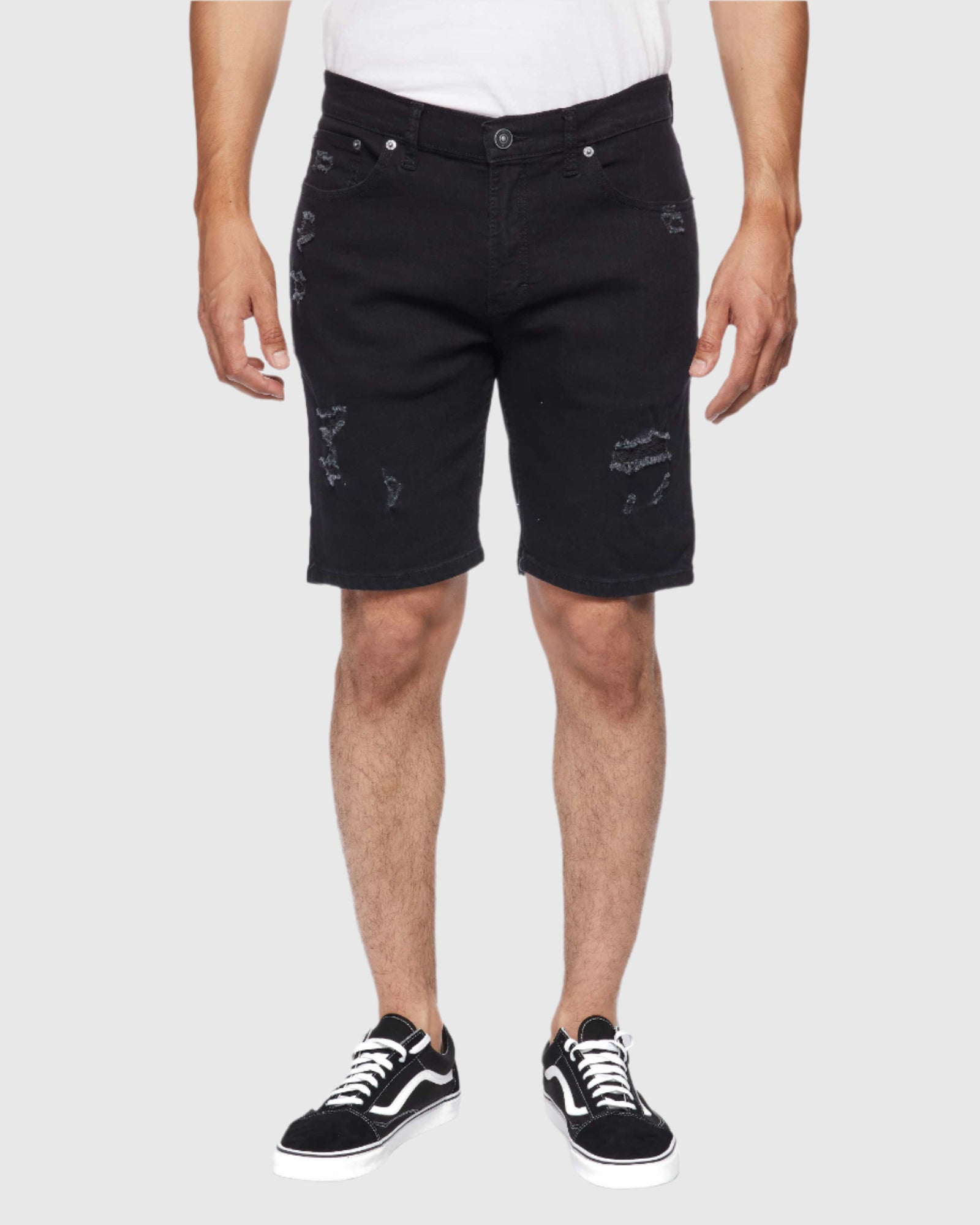 Model showcasing front view of Men’s Ripper Denim Shorts in Black Paradise
