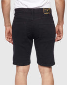 Back view of model in Black Paradise Men’s Ripper Denim Shorts by Ring of Fire