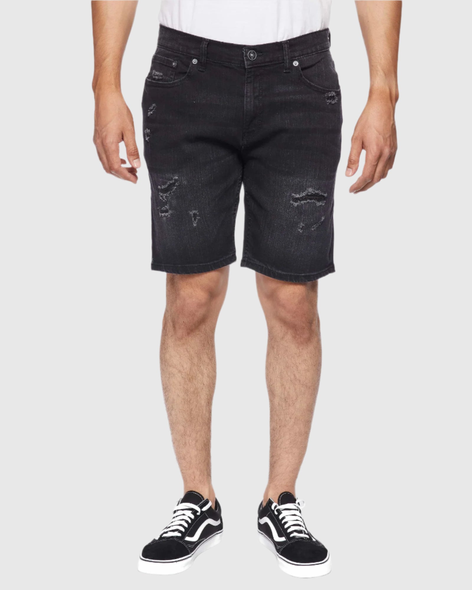 Front shot of model wearing Carbon Men’s Ripper Denim Shorts by Ring of Fire