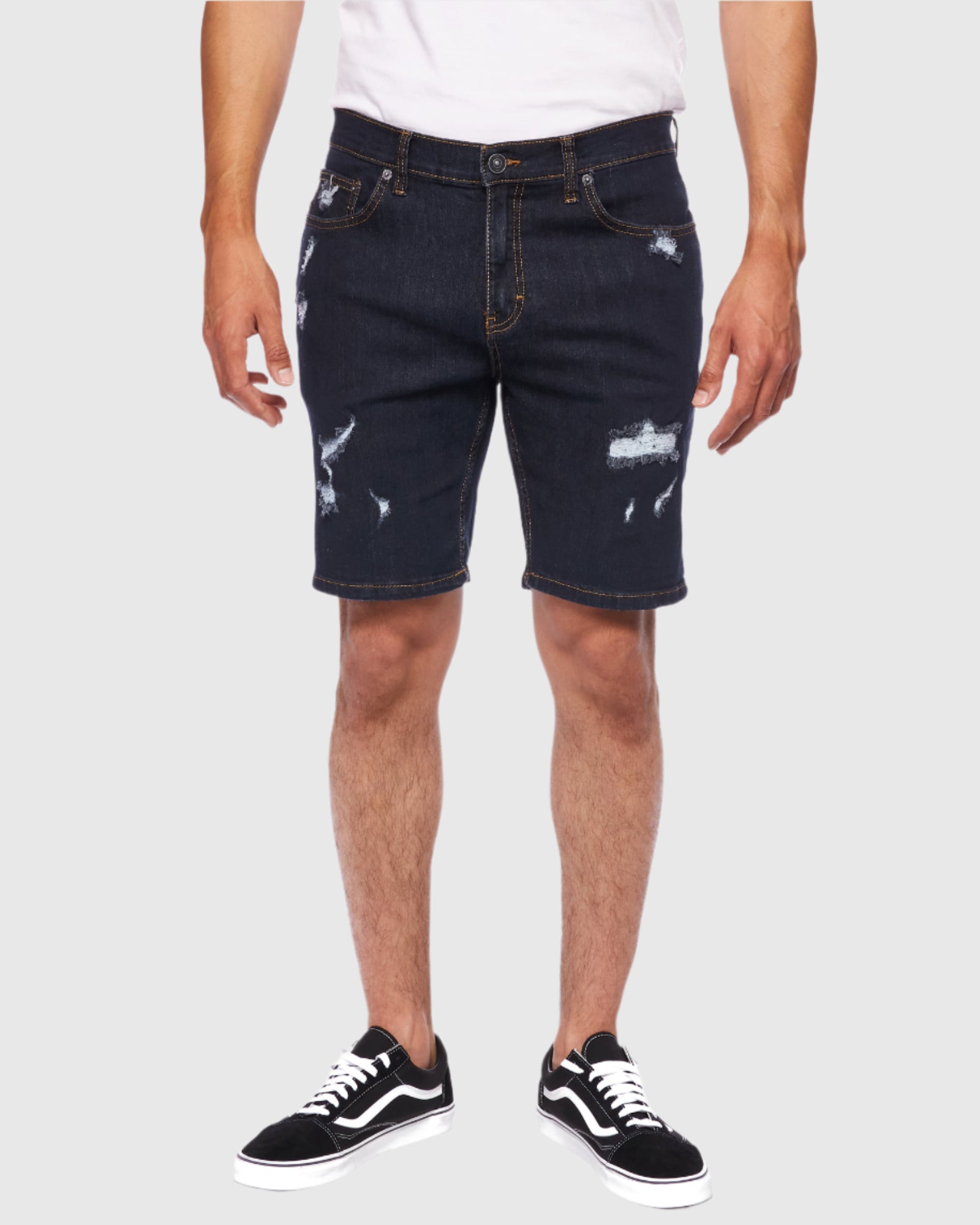 Front view of model showcasing Rinse Men’s Ripper Denim Shorts from Ring of Fire