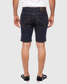 Model showing back side of Rinse color Men’s Ripper Denim Shorts by Ring of Fire